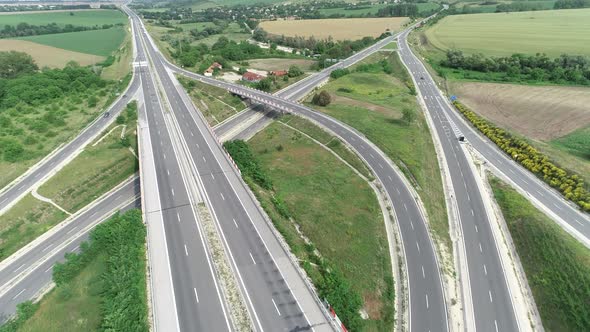 Aerial high drone flight over Highway and overpass.