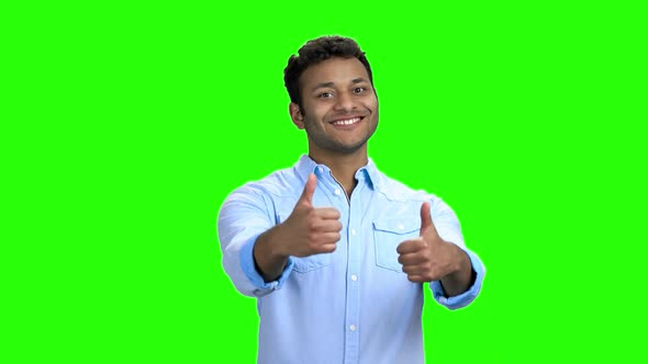 Cheerful Indian Guy Giving Two Thumbs Up