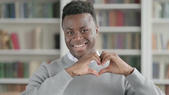 Portrait of African Man Showing Heart Shape By Hands