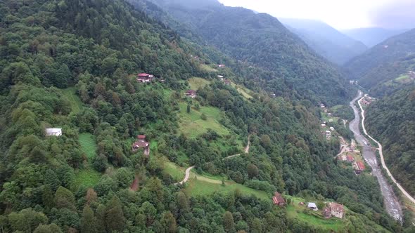 Wooden Traditional Architecture Village Houses in the Forest on the Mountain and Deep Valley