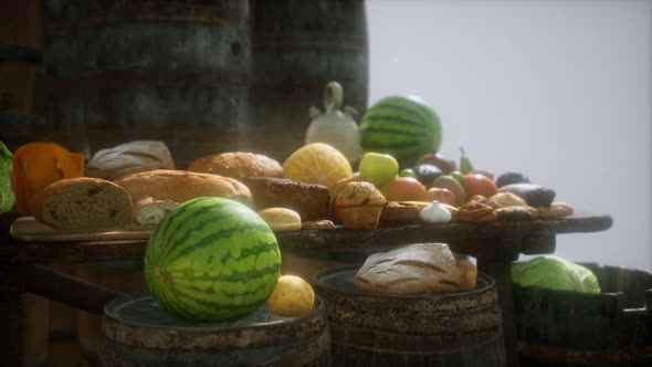 Food Table with Wine Barrels and Some Fruits Vegetables and Bread