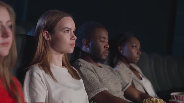 Young Girl Watching Scary Movie in Cinema.