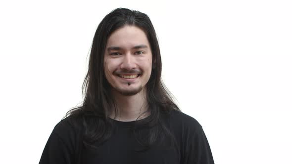 Closeup of Happy Handsome Eastasian Man with Moustache and Long Dark Hairstyle Smiling at Camera and