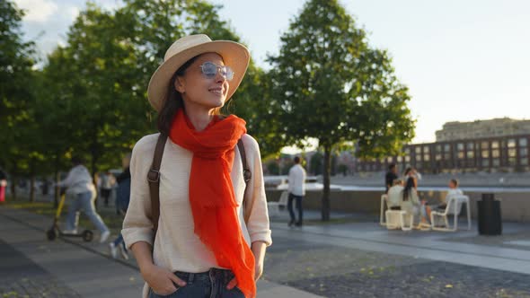 Attractive young tourist walking in european city