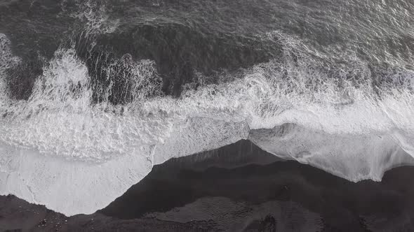 Top view of majestic waves at Vik black sand beach - Amazing nature aerial sc