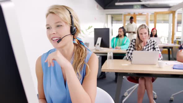 Call centre staff working in a modern office