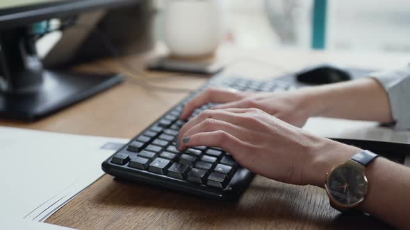 Woman Hand Typing on the Laptop Keyboard