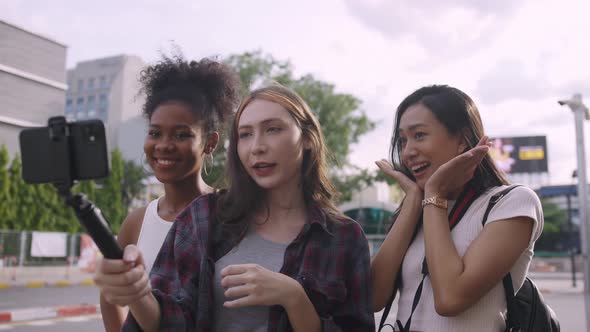 A group of multi-ethnic female friends enjoying the city tour.