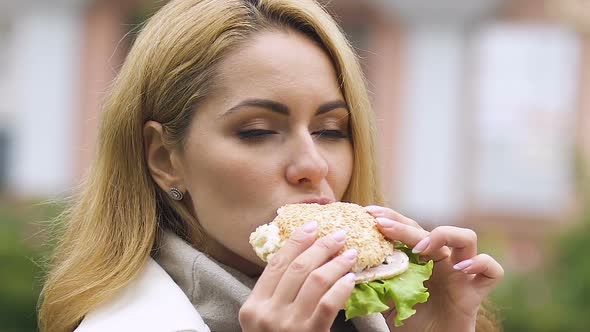 Pregnant Lady Eating Burger With Ham and Fresh Salad Healthy Appetite, Lunchtime