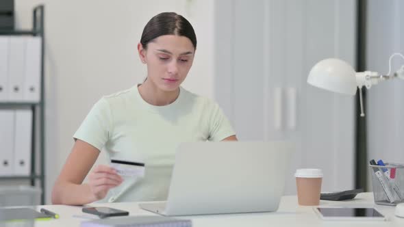 Excited Young Latin Woman Shopping Online on Laptop