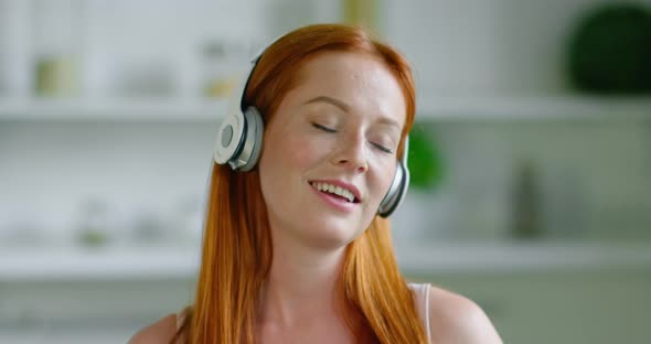 Happy Woman Listen Music in Wireless Headset