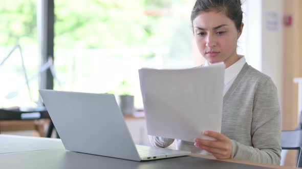 Professional Indian Woman Working on Laptop and Documents 