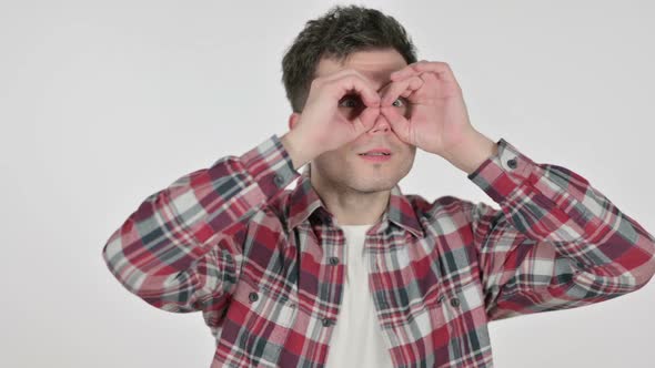 Portrait of Young Man Looking Around Binoculars