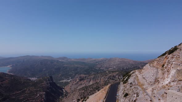 Mills in Motion on Mountain Peak By Mediterranean Sea Crete Greece