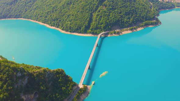 Bright summer view of Pivsko lake with bridge.