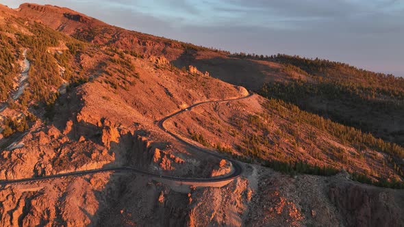 Aerial Panoramic Dramatic View of a Wilderness Mountain Peak and a Road Forest Rocky Volcanic