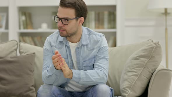 Worried Young Man Feeling Anxious at Home