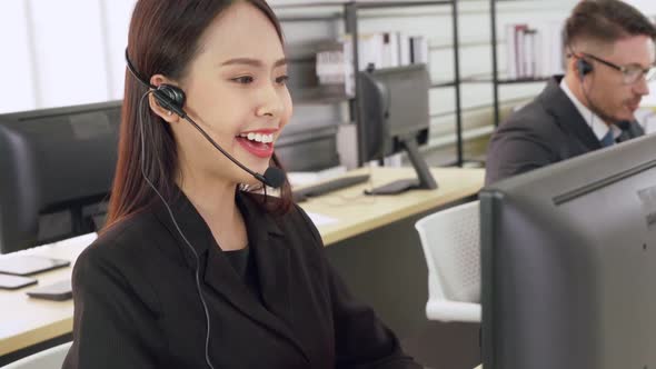 Business People Wearing Headset Working in Office