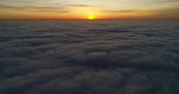 Breathtaking Sunset Above Clouds
