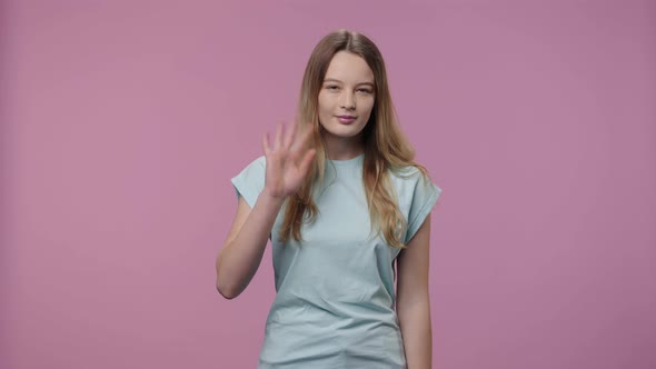 Portrait of Model with Natural Beauty Waves Hello and Makes Hand Gesture to Come Here