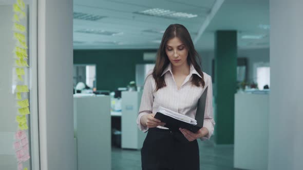 Young Business Woman with Empty Office Documents