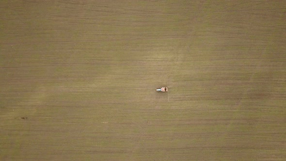 A Tractor On The Farm Field