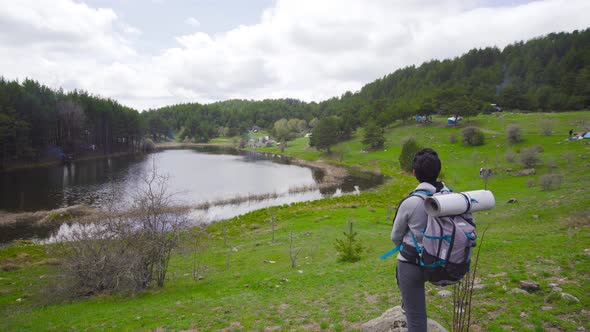 The hiker is watching the view.