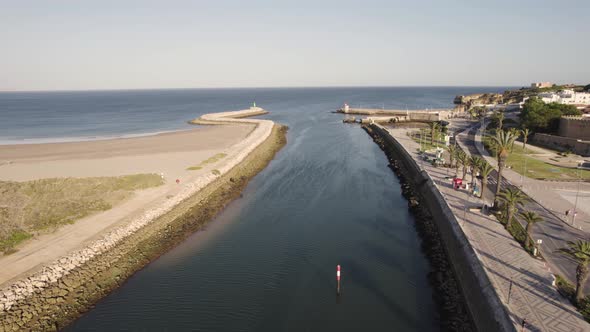 Flying over the canal of the Bensafrim River towards the ocean