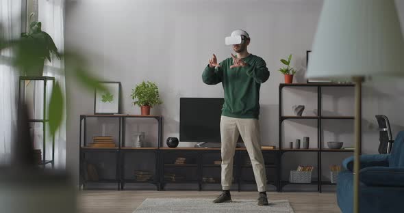 Modern Technology of Virtual Reality for Home Use Man Is Wearing Hmd Display for Connecting Internet
