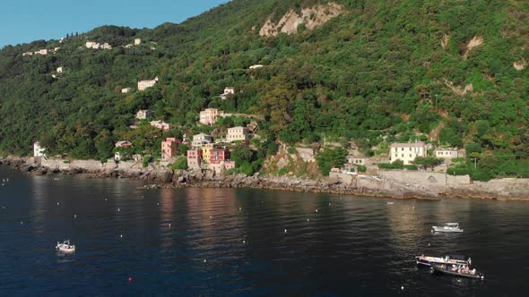 Aerial footage of Porto Pidocchio, a small village by the sea near Punta Chiappa in Portofino (Italy