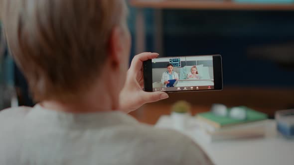 Elder Person Chatting on Remote Teleconference at Home