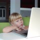 Small Girl Watching on the Computer in Child Cafeteria - VideoHive Item for Sale