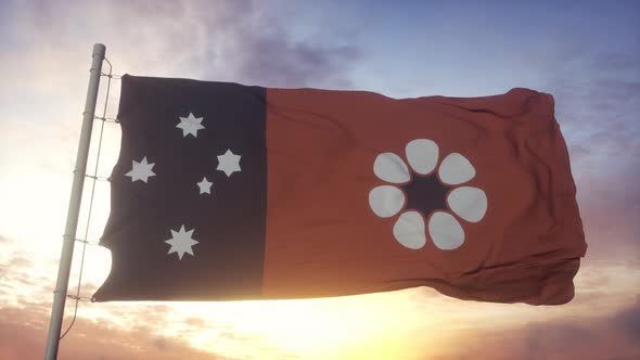 Northern Territory Flag Italy Waving in the Wind Sky and Sun Background