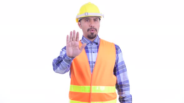 Serious Bearded Persian Man Construction Worker with Stop Gesture