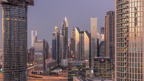 Dubai International Financial Centre District with Modern Skyscrapers Day to Night Timelapse