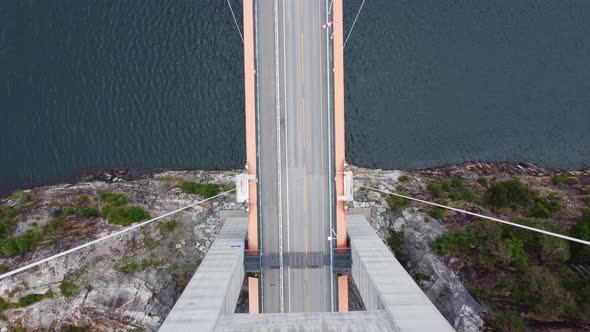 Hardanger bridge - Spectacular top down view from in between tower columns to road with hardangerfjo