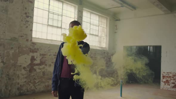 Fashionable young man in an abandoned warehouse