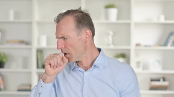 Portrait of Sick Middle Aged Businessman Coughing
