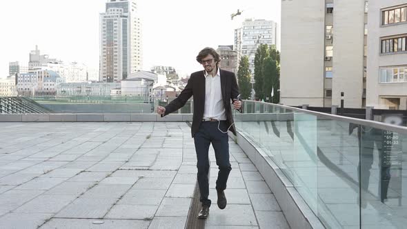 Businessman Listens to Music on the Way to Work