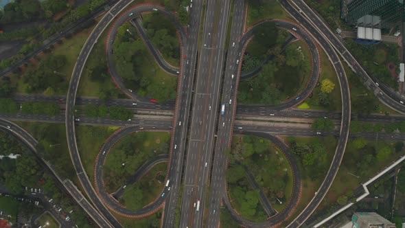 Top Down Overhead Aerial View of Busy Car Traffic on a Modern Large Multi Lane Intersection on a