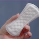 The Hand Holds a Closeup of the Woman's Sanitary Napkin - VideoHive Item for Sale