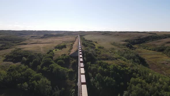 Drone footage of Battle River Trestle Bridge in Alberta. Freight rain traveling through