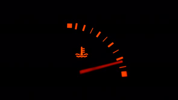 Color Image of a Car's Oil Icon Lighting Up on the Dashboard