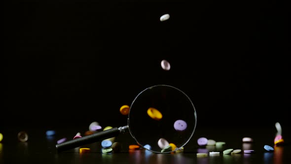 Buttons falling and a magnifying glass, Ultra Slow Motion alt