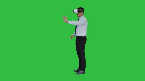 Businessman in virtual reality headset walking in virtual