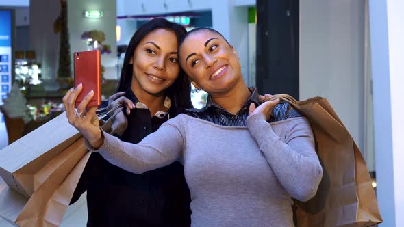 Women Make Selfie with Shopping Bags