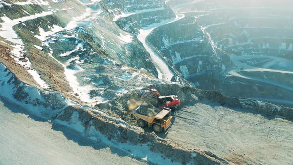 Industrial Machines are Loading Ore in the Mine Pit