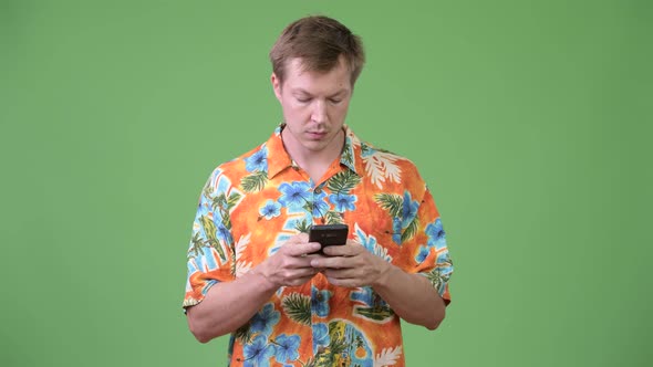 Young Handsome Tourist Man Using Phone