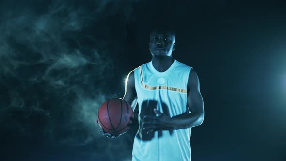 African Sportsman is Holding a Basketball