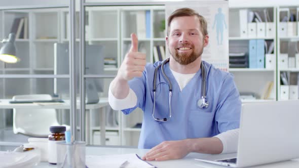 Happy Male Doctor Showing Thumbs Up and Smiling